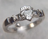 Custom claddagh ring with heart shaped diamond and 2 sapphires