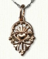 Ornate Pierced 
			Claddagh pendant in 14kt rose gold