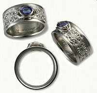 14KW Custom Mohan knot with alternating Crosses Ring set with an .85ct Oval Blue Sapphire- set East/West 