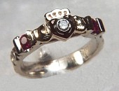 Custom Tri-color claddagh ring with 2 rubies and bezel set .10ct diamond