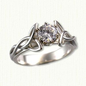 14kt white gold Bridged Open Wire Vanessa set with a round diamond.